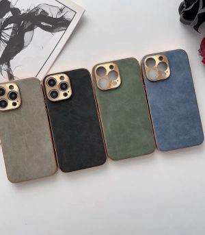 Variety of Electroplated Frame lambskin phone shell phone case in Grey, Blue, Black, and Green Colors with Gold Camera Lens on White Table